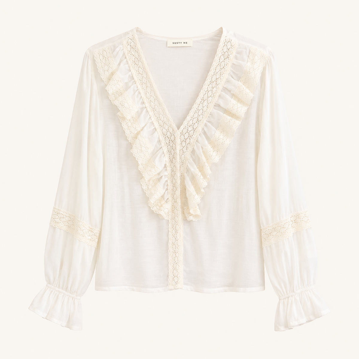 Camicia panna con volant, pizzo e maniche a sbuffo