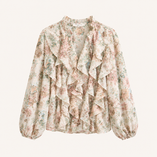 Camicia beige fantasia floreale con volant e maniche ampie e arricciature sul polso