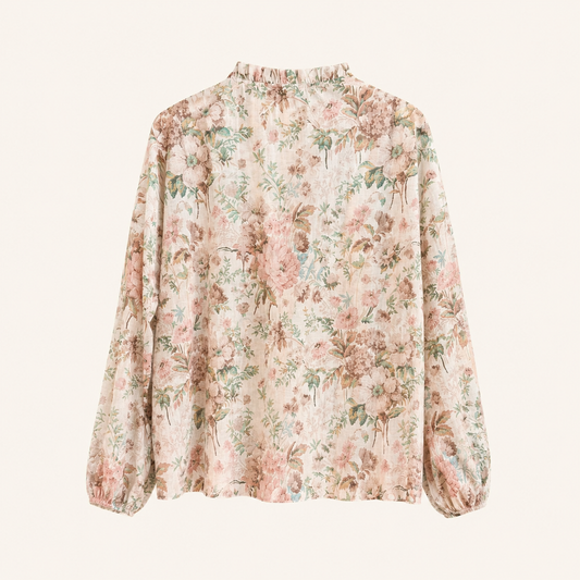 Camicia beige fantasia floreale con volant e maniche ampie e arricciature sul polso