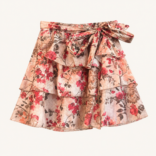 Gonna corta beige fantasia floreale con balze e fiocco in vita